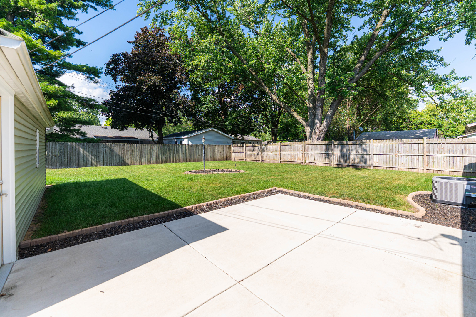 1614 East Dresser Road DeKalb, IL 60115 - Photo 20 of 26 a view of a backyard with a garden and plants