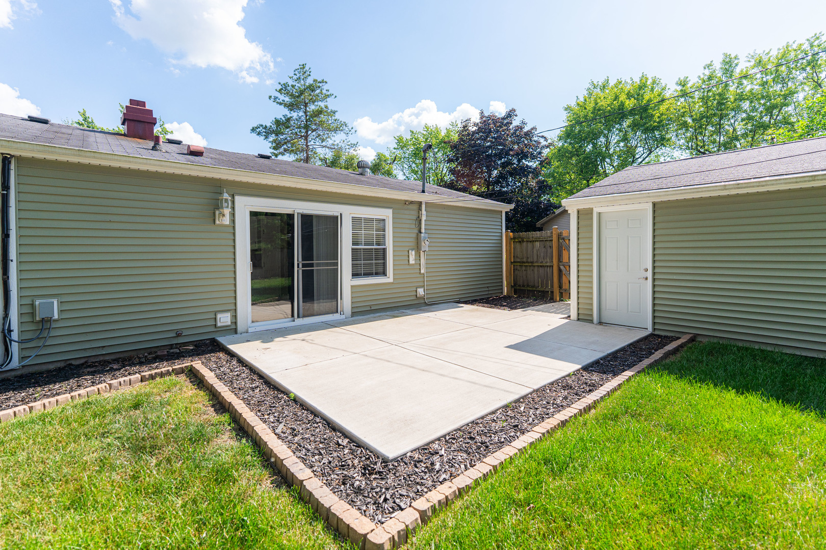 1614 East Dresser Road DeKalb, IL 60115 - Photo 21 of 26 a house with a yard