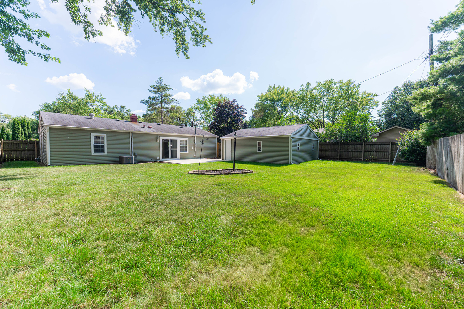 1614 East Dresser Road DeKalb, IL 60115 - Photo 23 of 26 a house view with a sitting space and garden