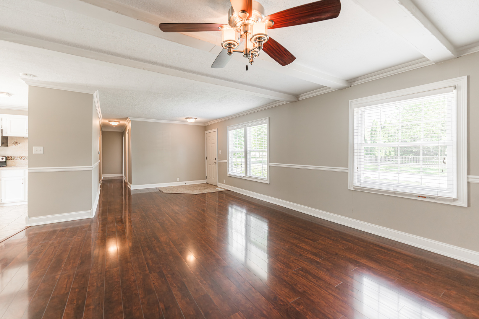 1614 East Dresser Road DeKalb, IL 60115 - Photo 5 of 26 a view of an empty room with wooden floor and a window