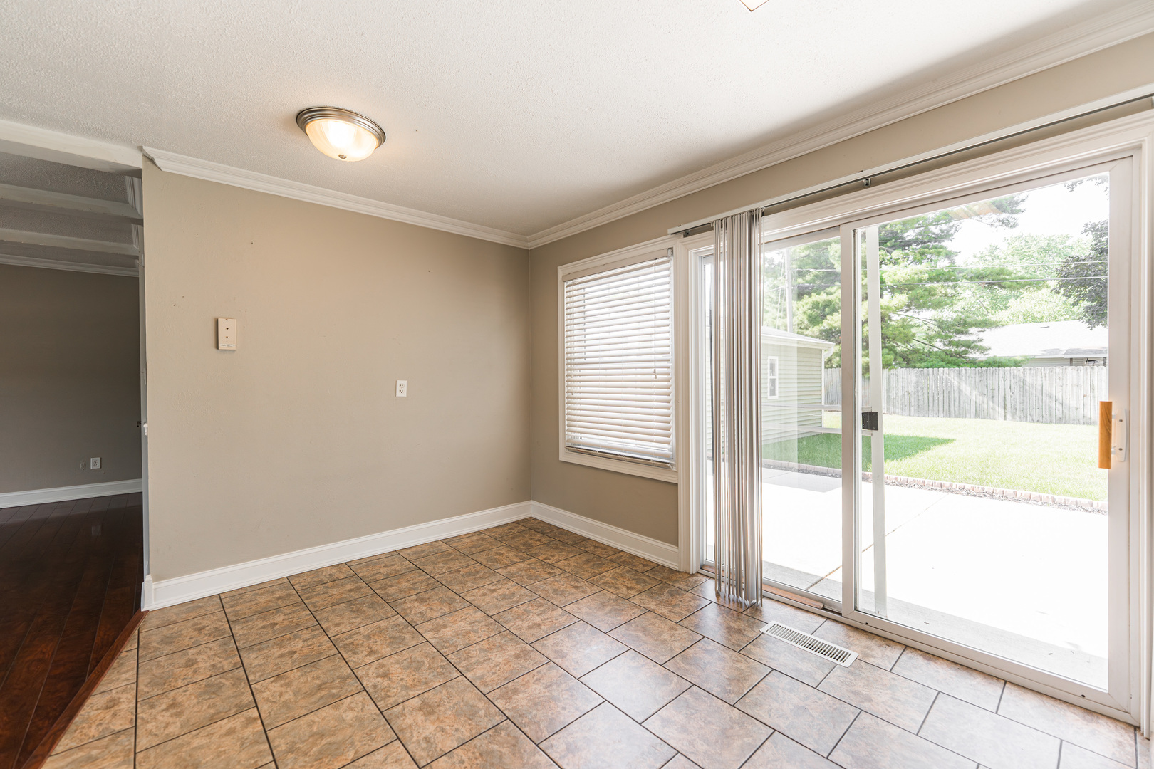 1614 East Dresser Road DeKalb, IL 60115 - Photo 8 of 26 a view of an empty room and window
