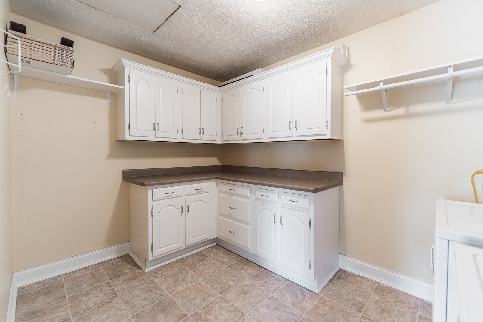 1614 East Dresser Road DeKalb, IL 60115 - Photo 10 of 26 a view of cabinets a sink and dishwasher in a white cabinet