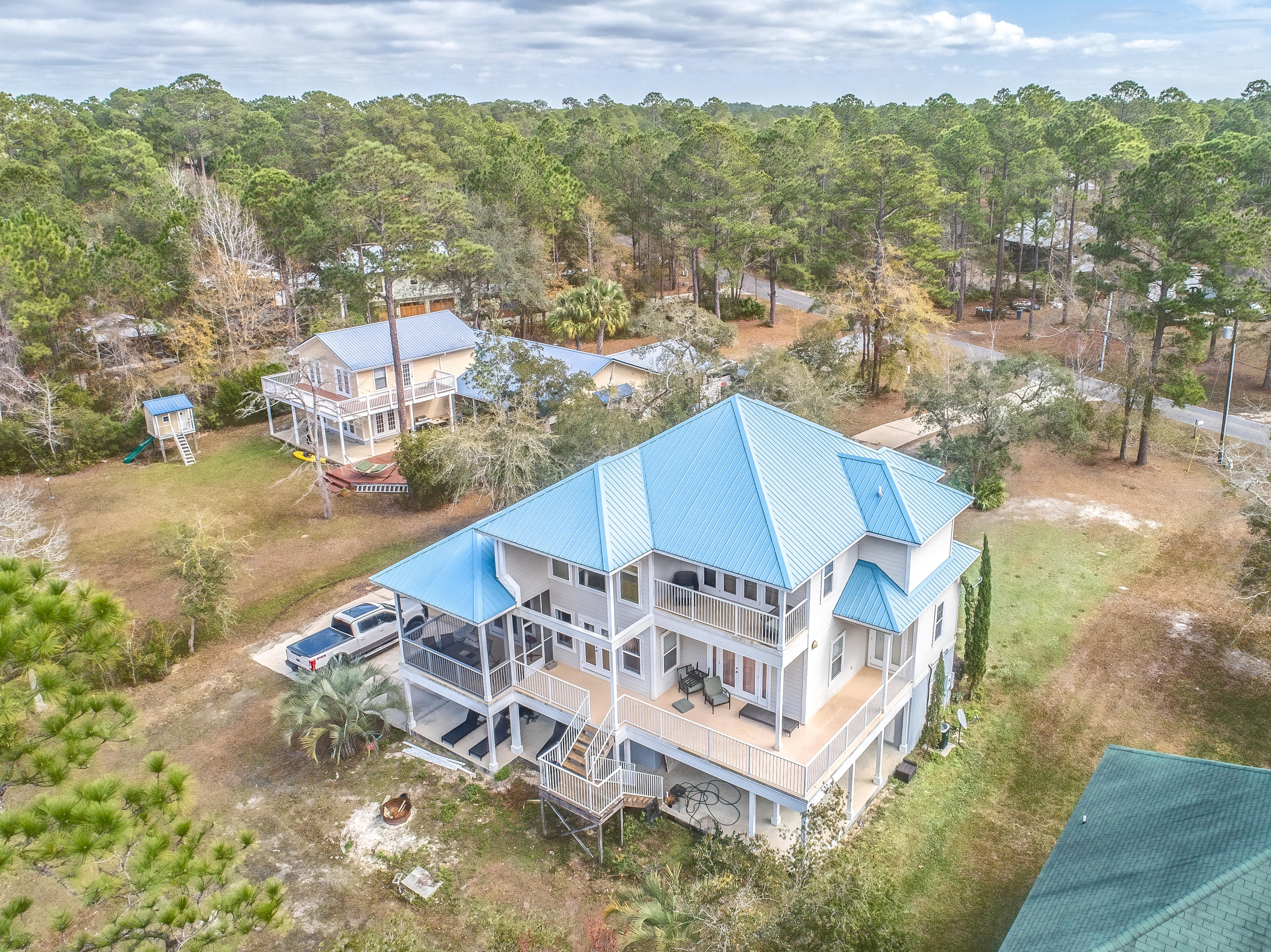556 Mallet Bayou Road Freeport, FL 32439 - Photo 1 of 29 an aerial view of a house with a ocean beach