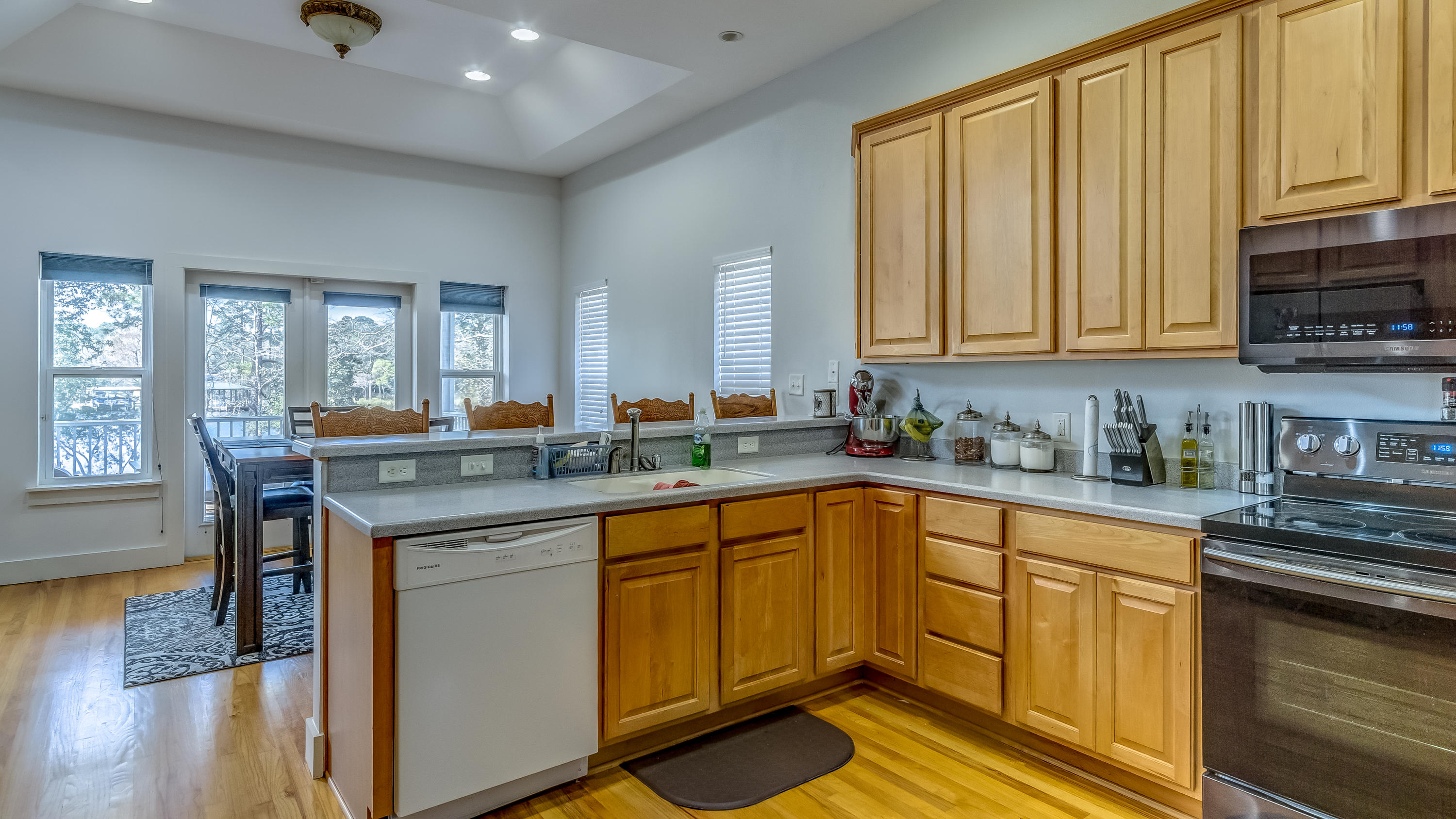 556 Mallet Bayou Road Freeport, FL 32439 - Photo 12 of 29 a kitchen with stainless steel appliances granite countertop a sink stove and cabinets