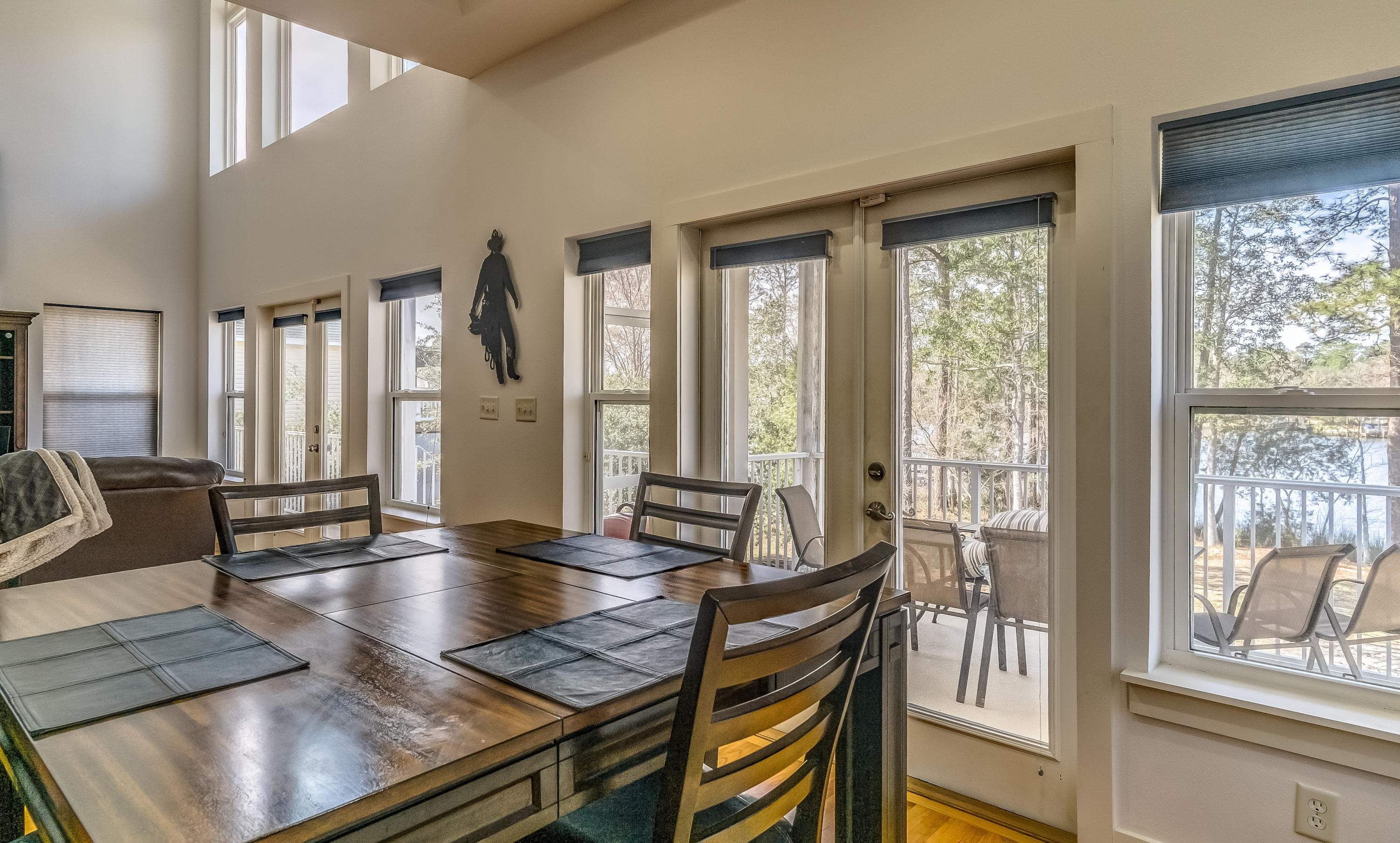 556 Mallet Bayou Road Freeport, FL 32439 - Photo 16 of 29 a view of a dining room with furniture and wooden floor