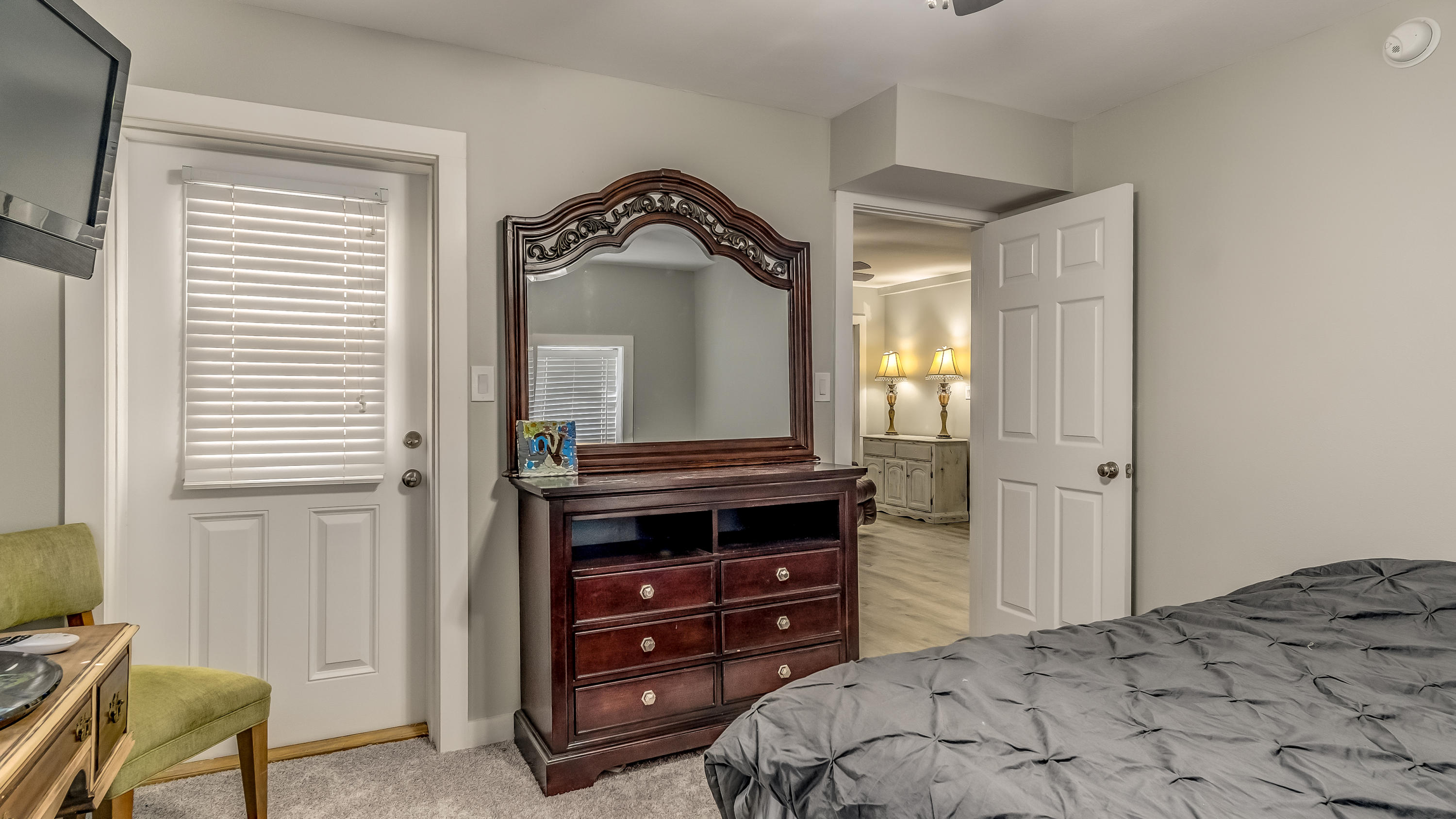 556 Mallet Bayou Road Freeport, FL 32439 - Photo 25 of 29 a bedroom with a bed and a mirror on dresser