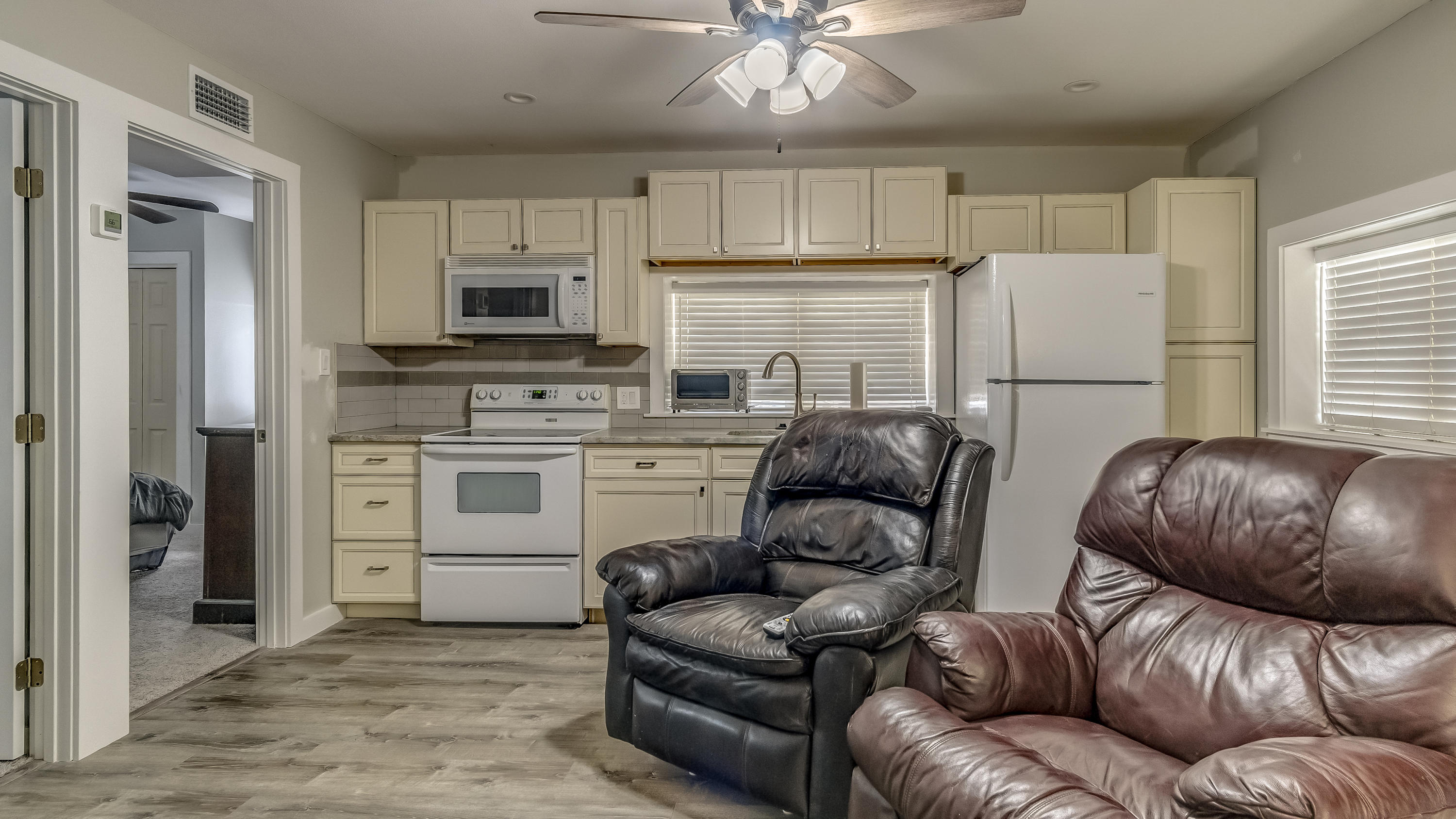 556 Mallet Bayou Road Freeport, FL 32439 - Photo 27 of 29 a living room with furniture a fireplace and a window