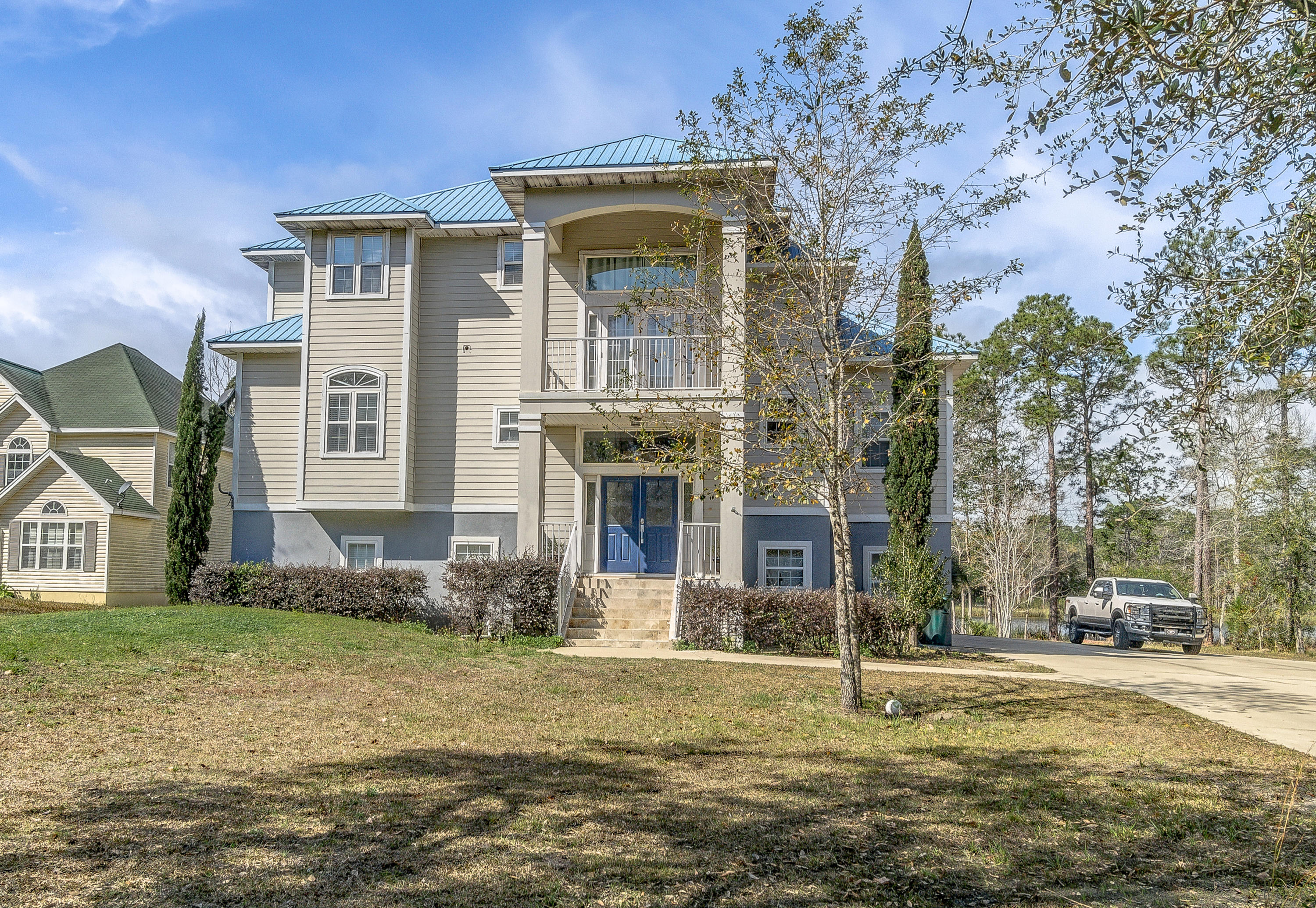 556 Mallet Bayou Road Freeport, FL 32439 - Photo 8 of 29 a front view of a house with a yard