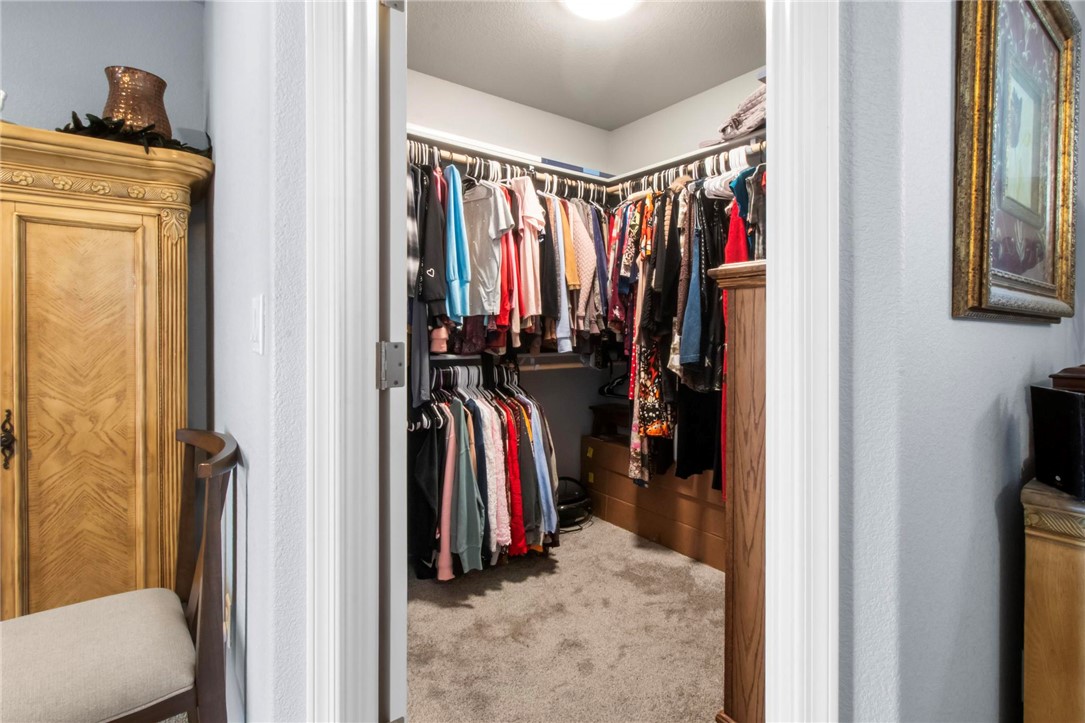 3897 Easy Street Kingman, AZ 86409 - Photo 21 of 53 a view of walk in closet with clothes and shoes