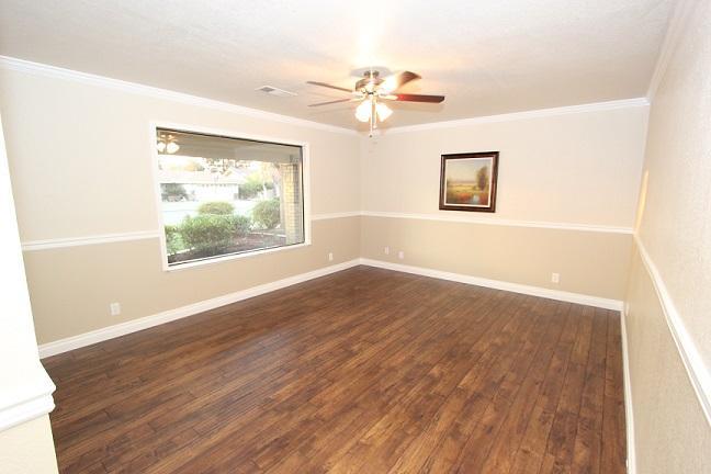 1762 North Hope Avenue Reedley, CA 93654 - Photo 3 of 21 LIVING ROOM NEW LAMINATE FLOORING & TWO TONED PAINT WTH CHAIR RAILS & WIDE BASEBOARDS