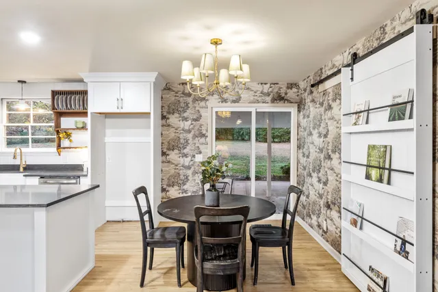 a dining room with furniture and window