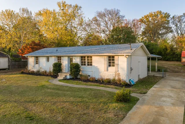 a front view of a house with garden