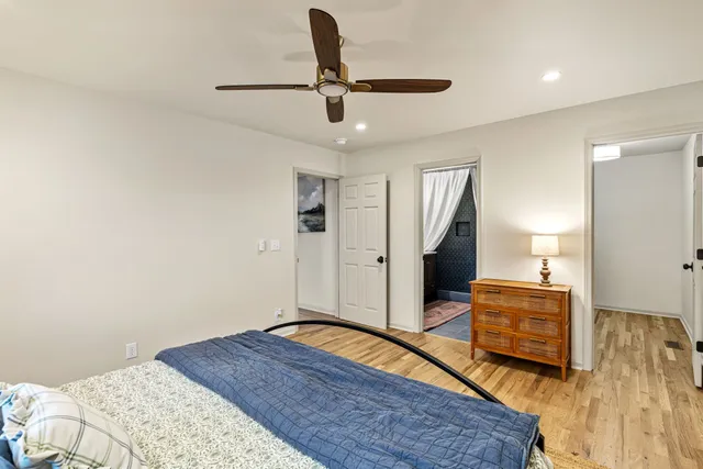 a bedroom with a bed and a dresser