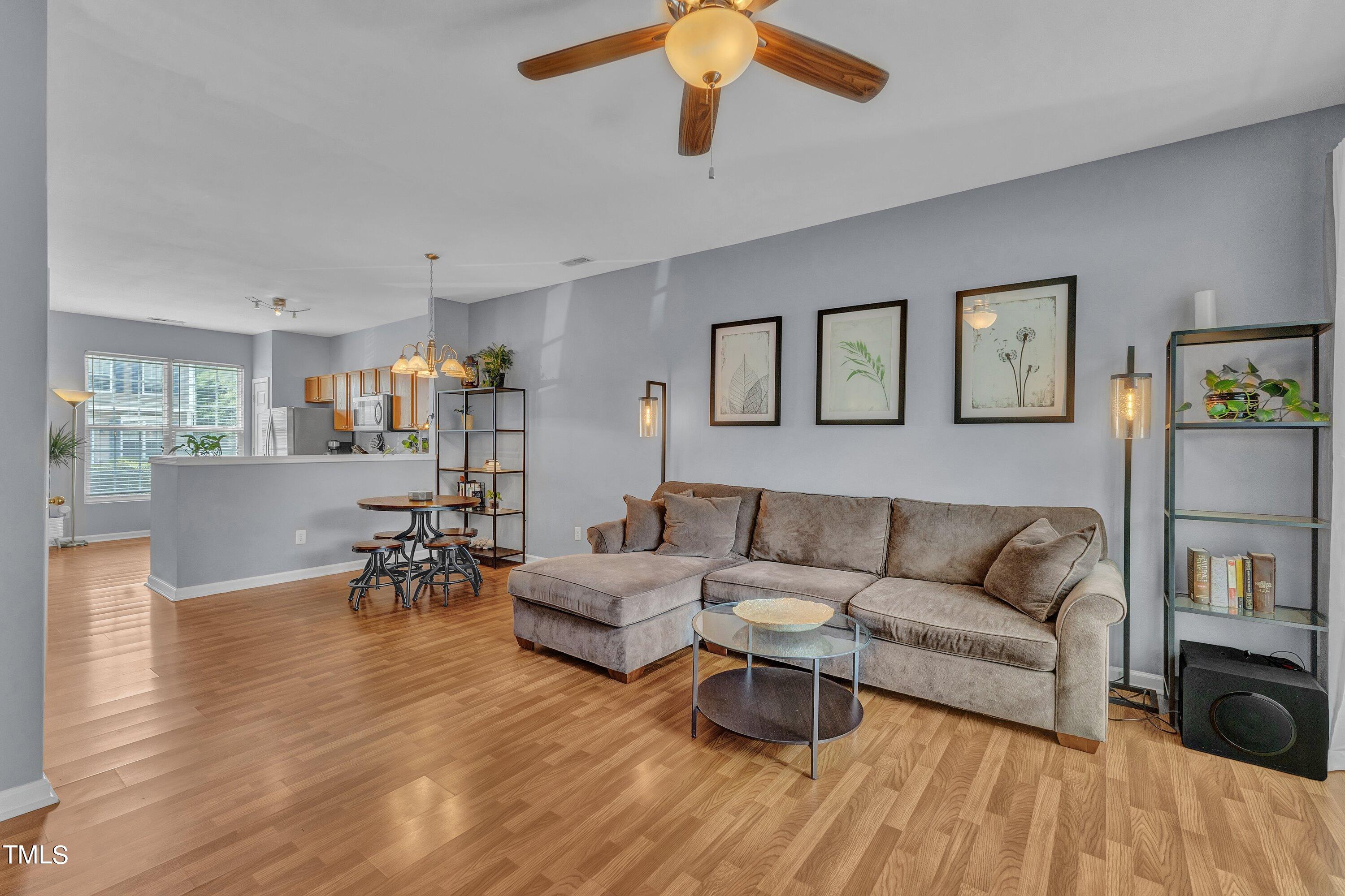 1743 Sorrell Brook Way Raleigh, NC 27609 - Photo 13 of 30 a living room with furniture and a wooden floor