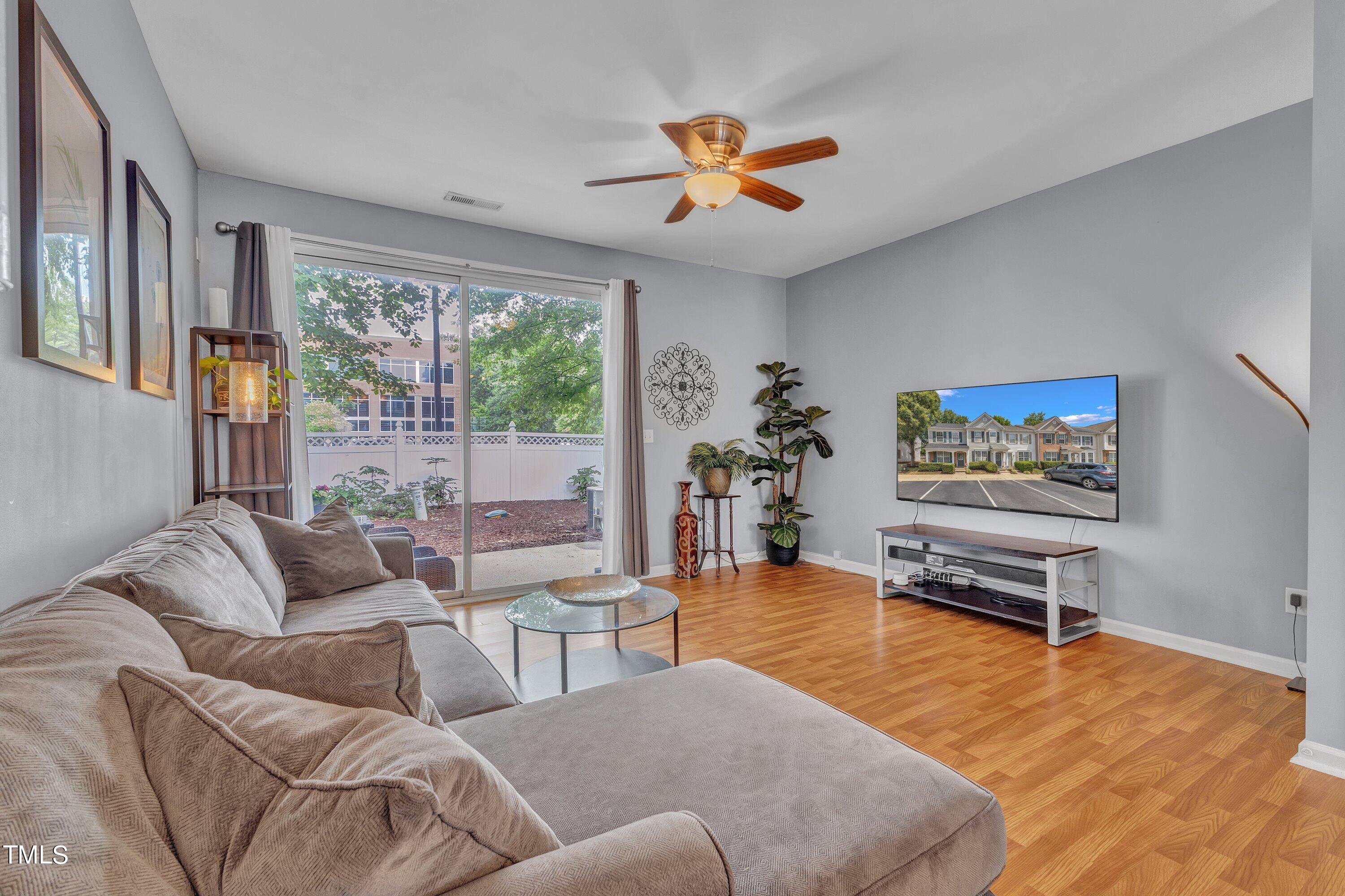 1743 Sorrell Brook Way Raleigh, NC 27609 - Photo 15 of 30 a living room with furniture and a large window