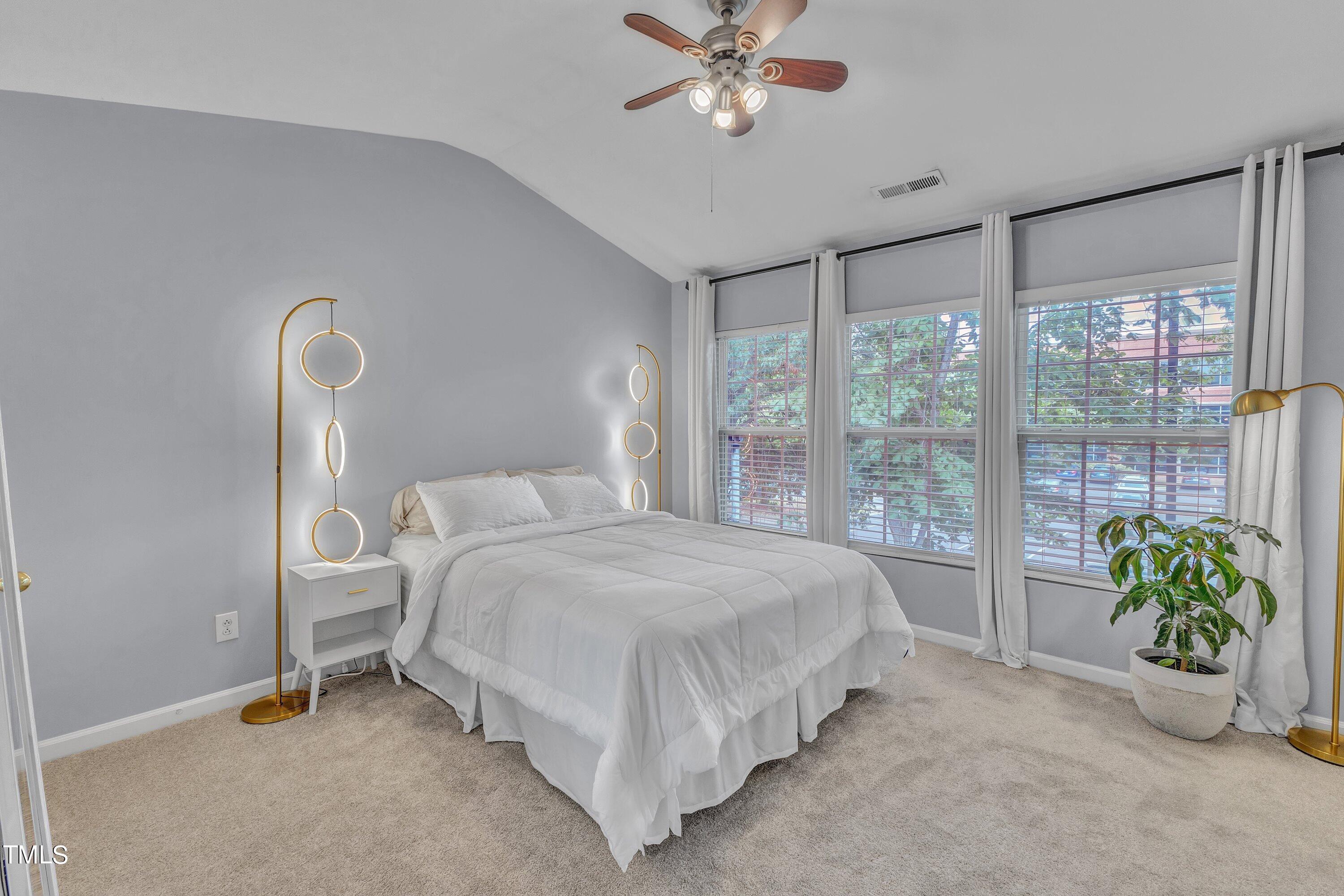 1743 Sorrell Brook Way Raleigh, NC 27609 - Photo 18 of 30 a spacious bedroom with a bed and a window