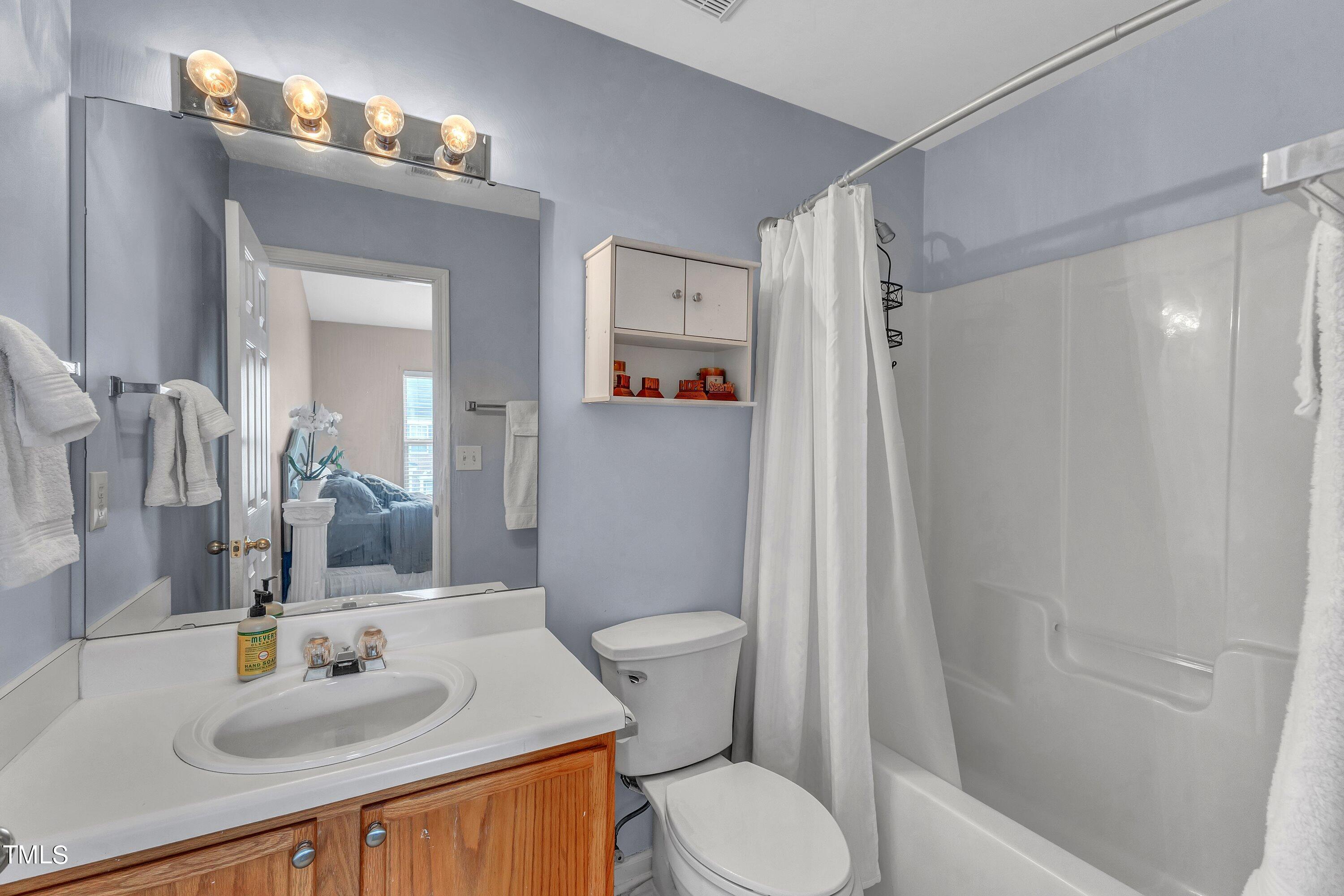 1743 Sorrell Brook Way Raleigh, NC 27609 - Photo 25 of 30 a bathroom with a sink toilet and shower