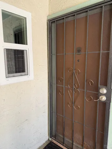 a bathroom with a shower and a sink