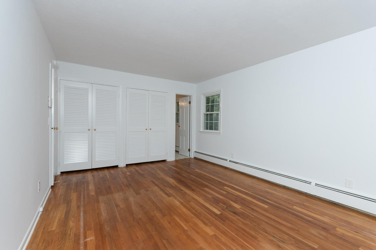 9 Summit Ridge Road New Canaan, CT 06840 - Photo 22 of 35 a view of an empty room with wooden floor