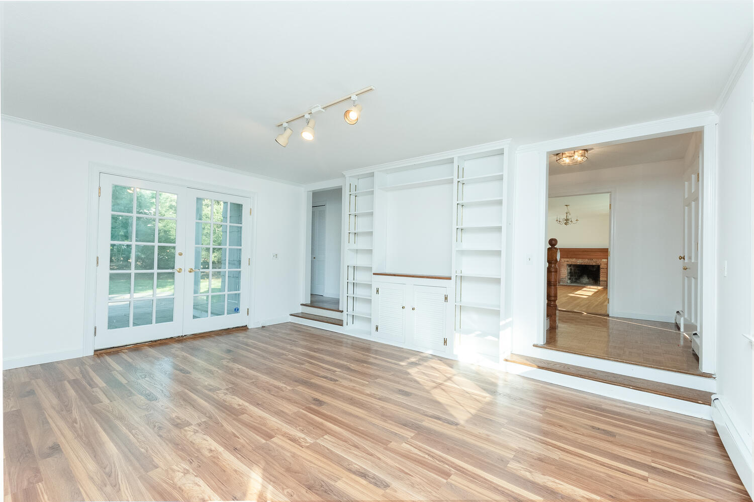 9 Summit Ridge Road New Canaan, CT 06840 - Photo 8 of 35 a view of empty room with wooden floor and fan