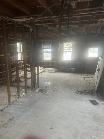 a view of an empty room with a fireplace