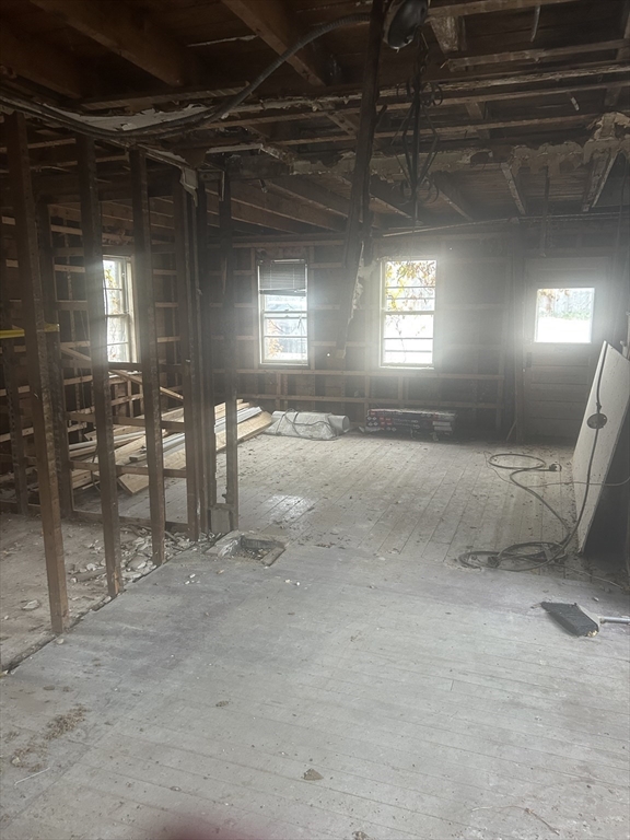 233 Marion Road Wareham, MA 02571 - Photo 2 of 10 a view of an empty room with a fireplace