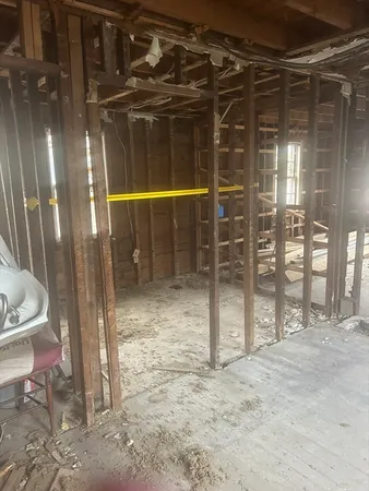 a view of an empty room with glass door