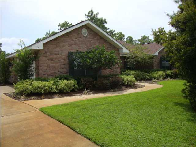 134 East Shipwreck Road Santa Rosa Beach, FL 32459 - Photo 1 of 23 a front view of a house with garden