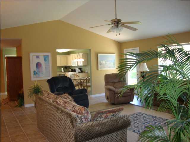 134 East Shipwreck Road Santa Rosa Beach, FL 32459 - Photo 3 of 23 a living room with furniture and a chandelier