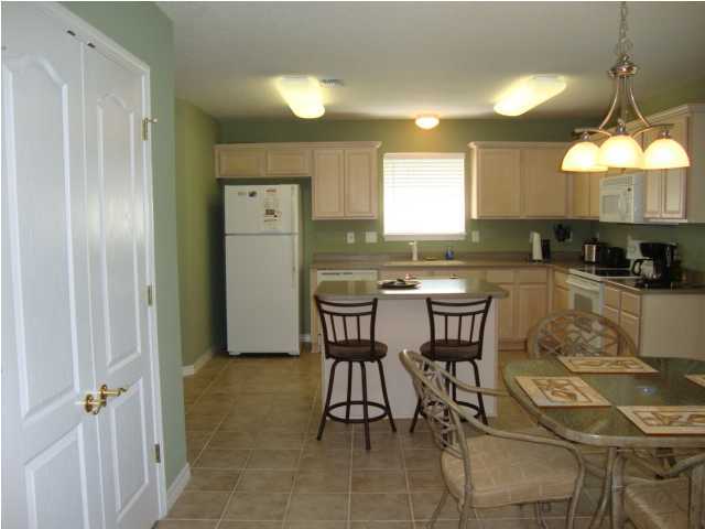 134 East Shipwreck Road Santa Rosa Beach, FL 32459 - Photo 5 of 23 a view of a dining room with furniture and a chandelier