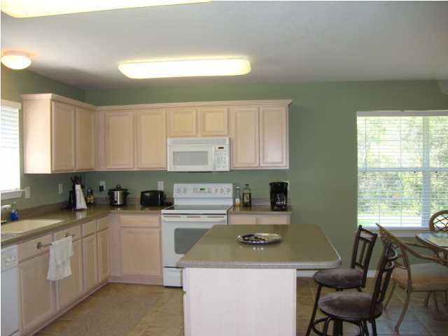 134 East Shipwreck Road Santa Rosa Beach, FL 32459 - Photo 6 of 23 a kitchen with a sink cabinets and window