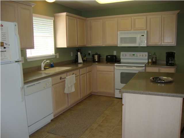 134 East Shipwreck Road Santa Rosa Beach, FL 32459 - Photo 8 of 23 a kitchen with a sink stove and cabinets