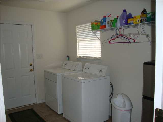 134 East Shipwreck Road Santa Rosa Beach, FL 32459 - Photo 9 of 23 a utility room with dryer and washer