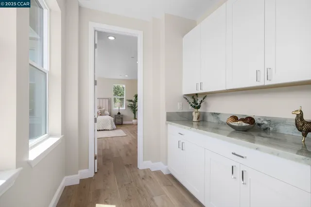 a kitchen with sink and cabinets