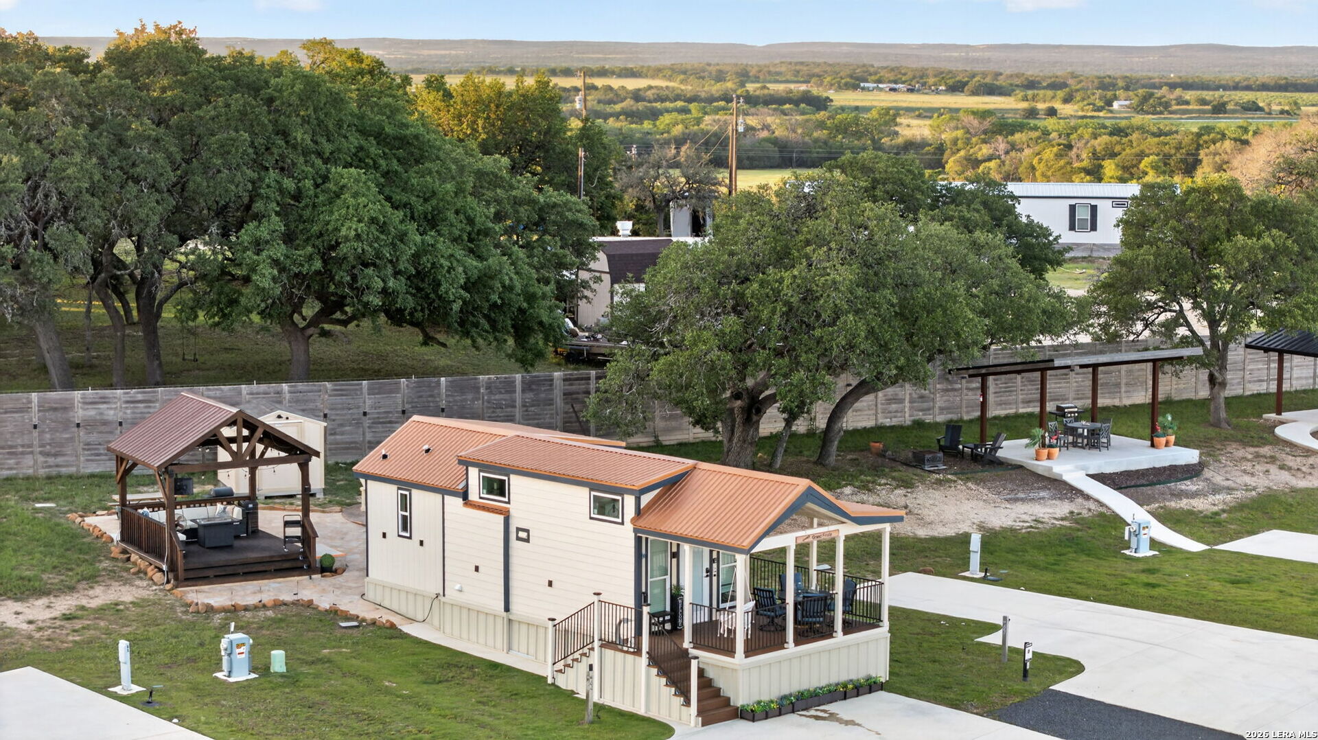 5386 Ranch Road 1376, Unit 64 Fredericksburg, TX 78624 - Photo 33 of 45 an aerial view of a house with a yard from a balcony