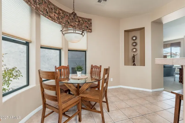 a kitchen with stainless steel appliances granite countertop a sink and a stove