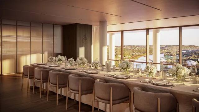 a view of balcony with chairs and potted plants with wooden floor