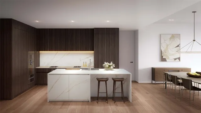 a kitchen with a stove a table and chairs