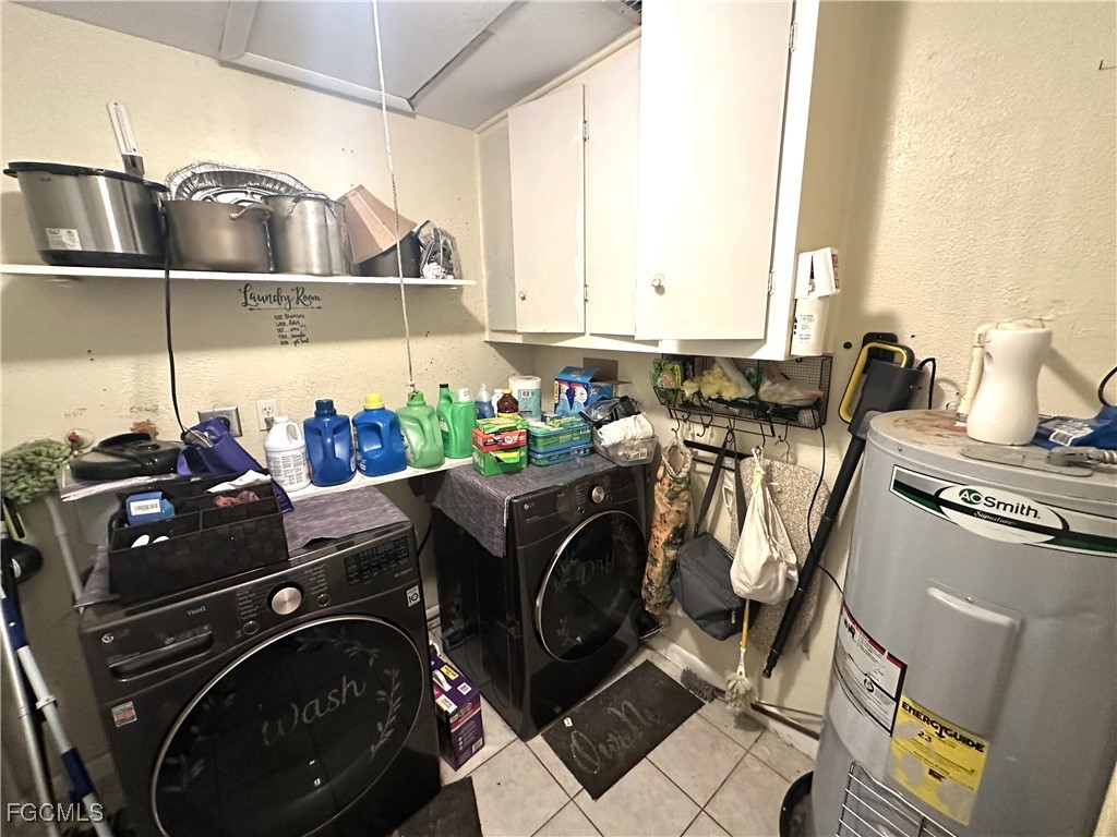 100 Davis Road Lehigh Acres, FL 33936 - Photo 19 of 32 a utility room with sink dryer and washer