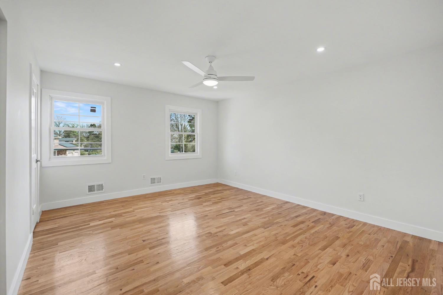 16 Hershey Road East Brunswick, NJ 08816 - Photo 27 of 50 wooden floor in an empty room with a window