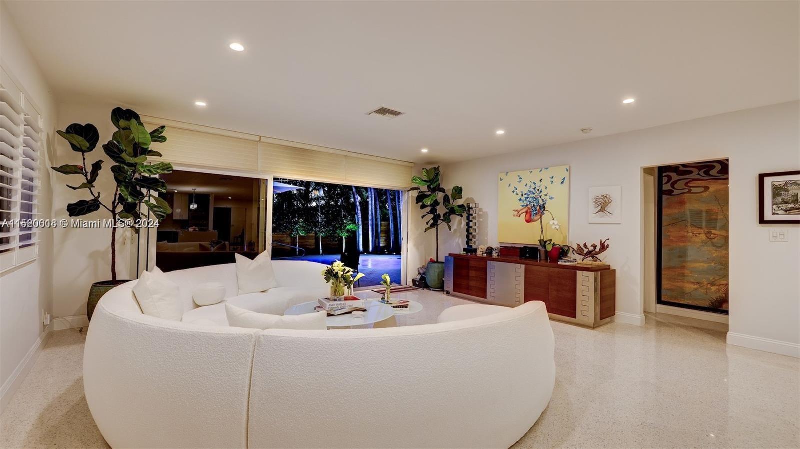 5250 Alton Road Miami Beach, FL 33140 - Photo 18 of 30 a living room with furniture and a large window