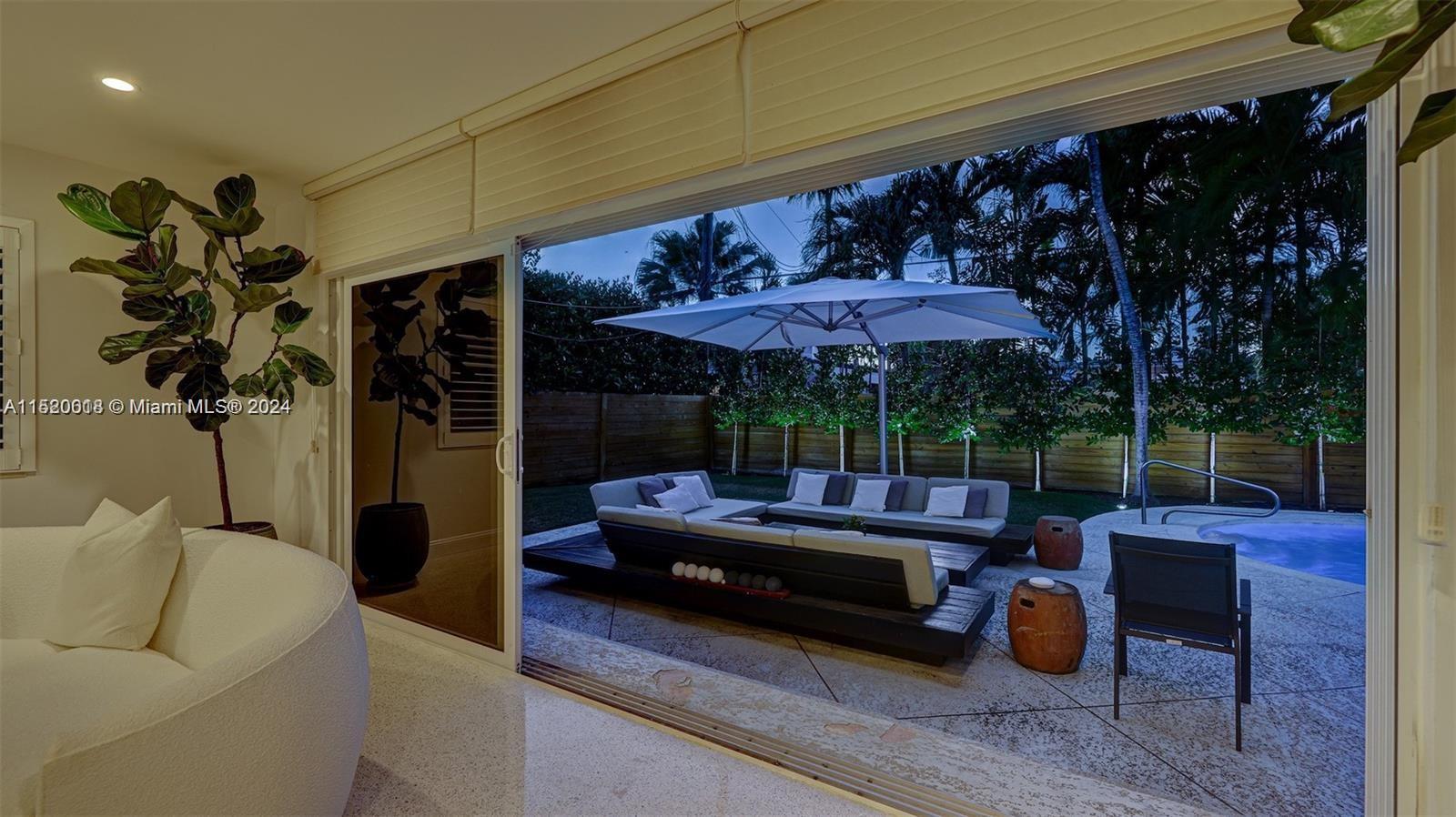 5250 Alton Road Miami Beach, FL 33140 - Photo 19 of 30 a outdoor living space with patio furniture and a potted plant