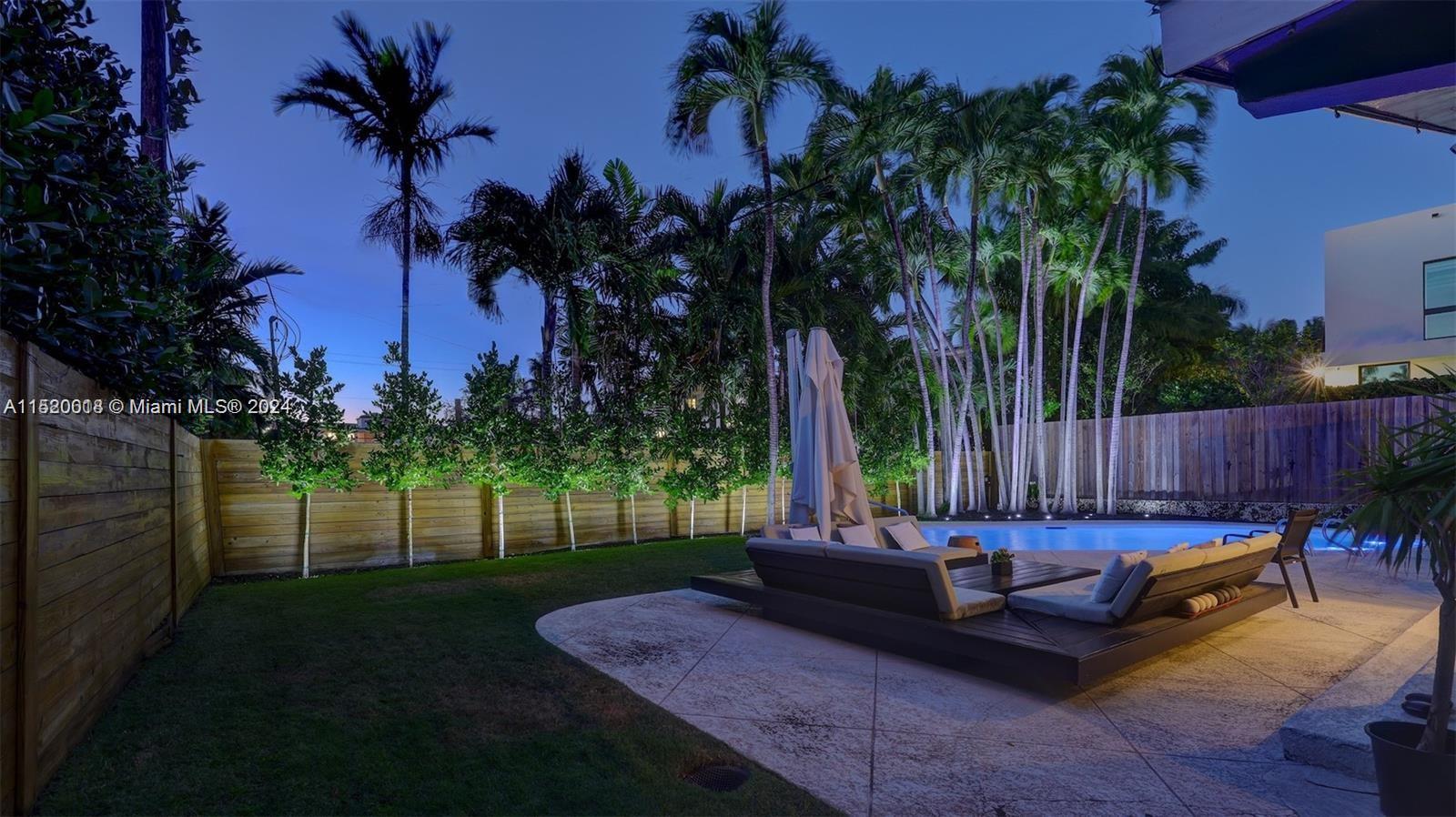 5250 Alton Road Miami Beach, FL 33140 - Photo 22 of 30 a garden view with a sitting space