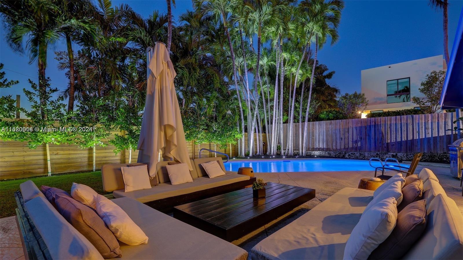 5250 Alton Road Miami Beach, FL 33140 - Photo 24 of 30 a view of a backyard with a patio and outdoor seating