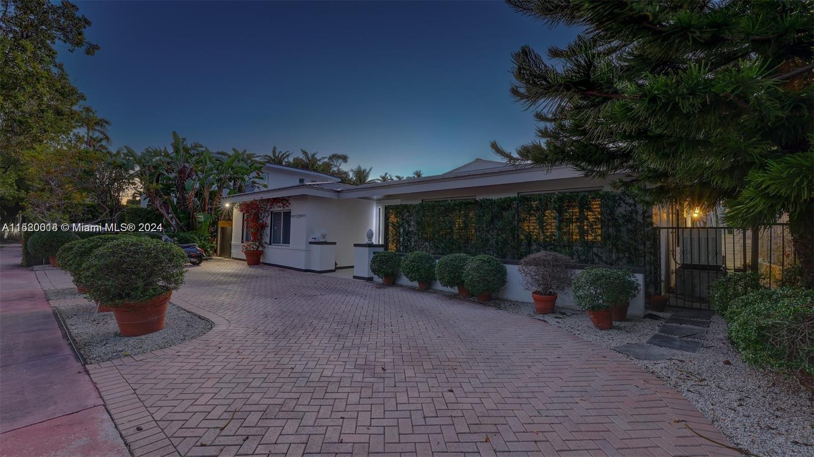 5250 Alton Road Miami Beach, FL 33140 - Photo 28 of 30 a view of a house with backyard and garden