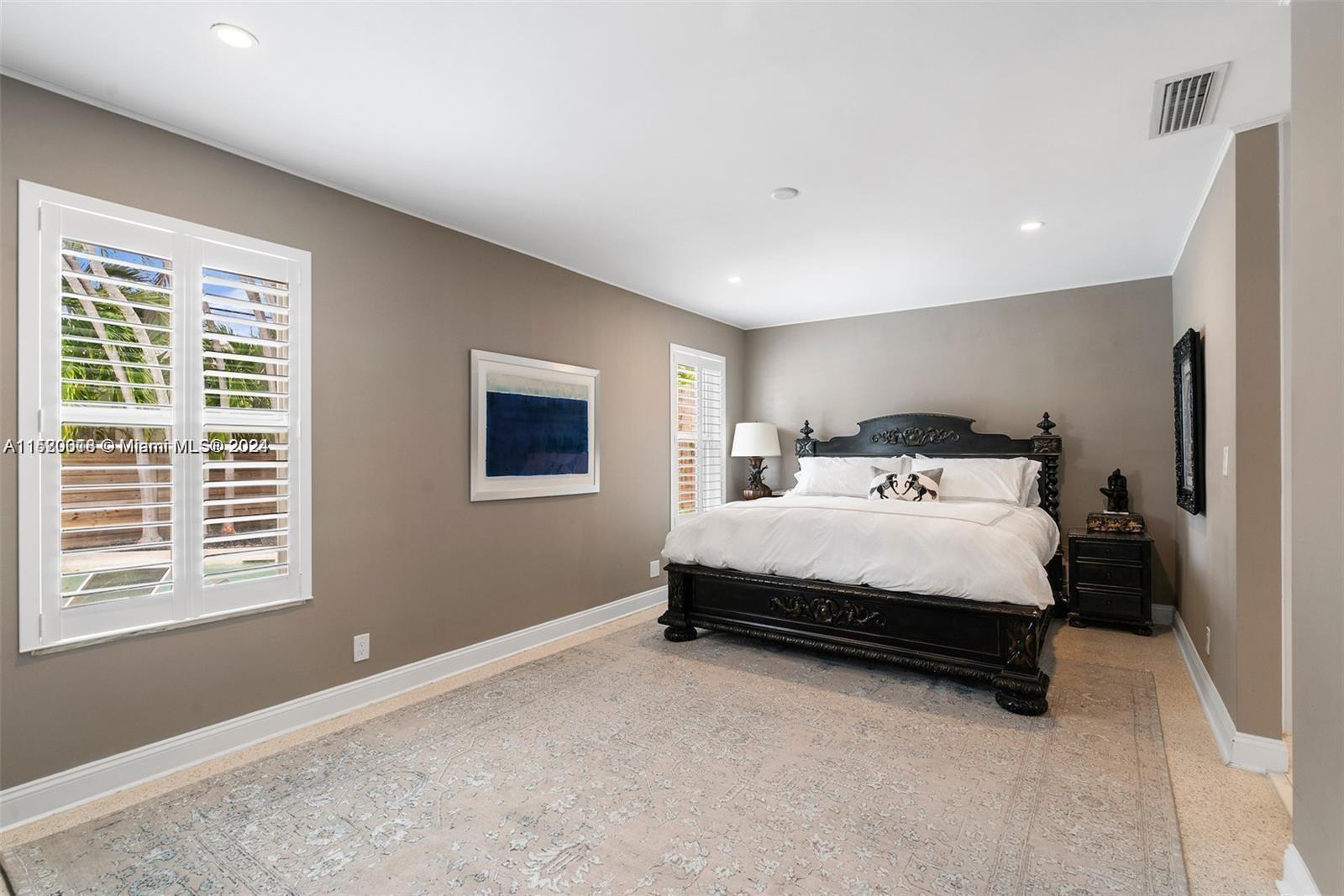 5250 Alton Road Miami Beach, FL 33140 - Photo 8 of 30 a bedroom with a bed and a window