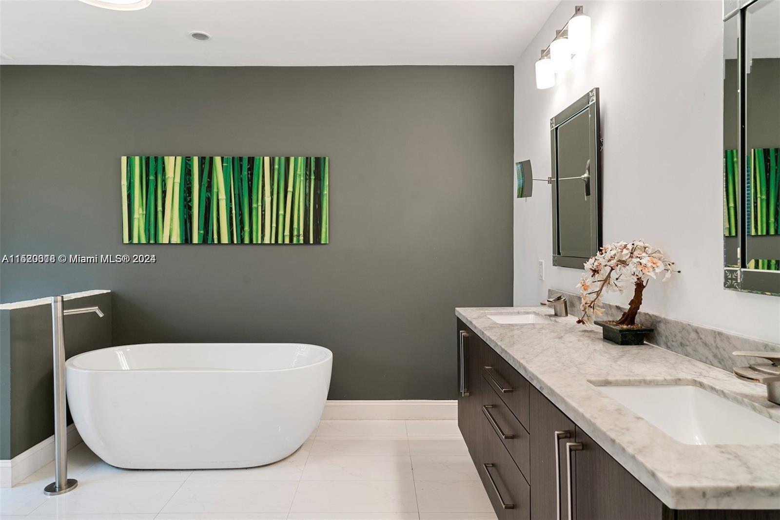 5250 Alton Road Miami Beach, FL 33140 - Photo 10 of 30 a bathroom with a granite countertop sink and a mirror