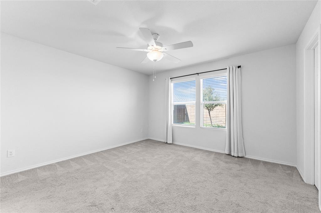 4432 Sagecroft Road Fort Worth, TX 76036 - Photo 6 of 16 Unfurnished room with light colored carpet and ceiling fan