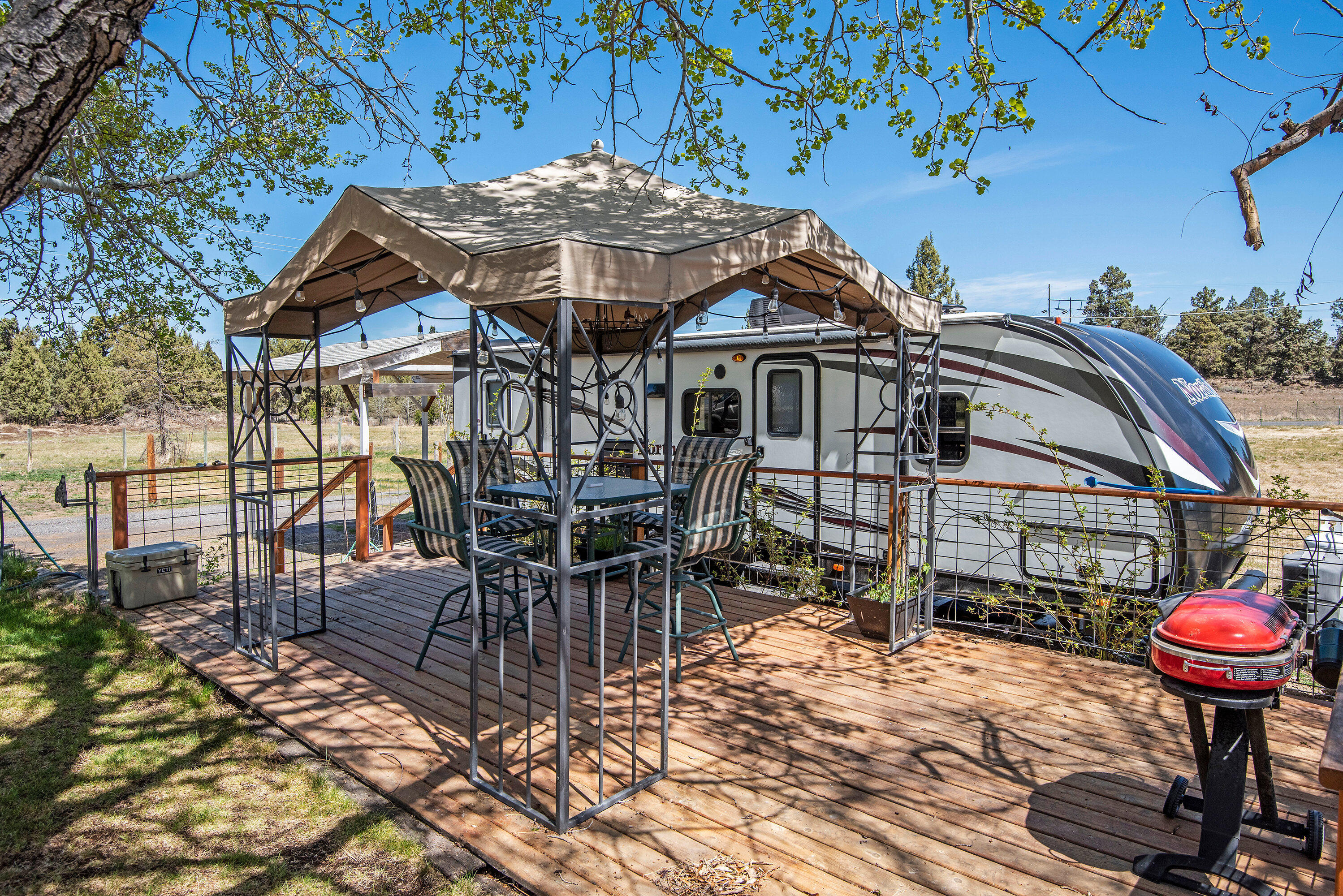 63591 Gentry Loop Bend, OR 97701 - Photo 15 of 24 a front view of a house with table and chairs