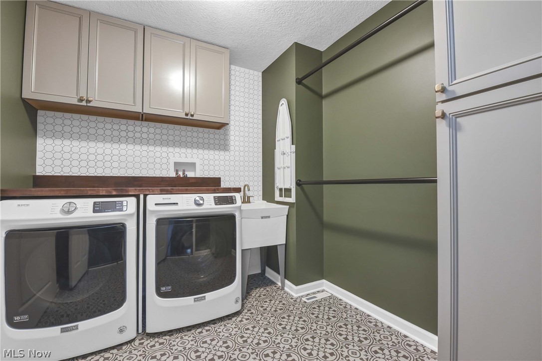 7599 Albion Road North Royalton, OH 44133 - Photo 29 of 45 Wall tiles, storage closet & cabinets